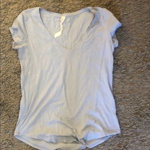 SOLD- Rarely worn lulu lemon blue short sleeve top
